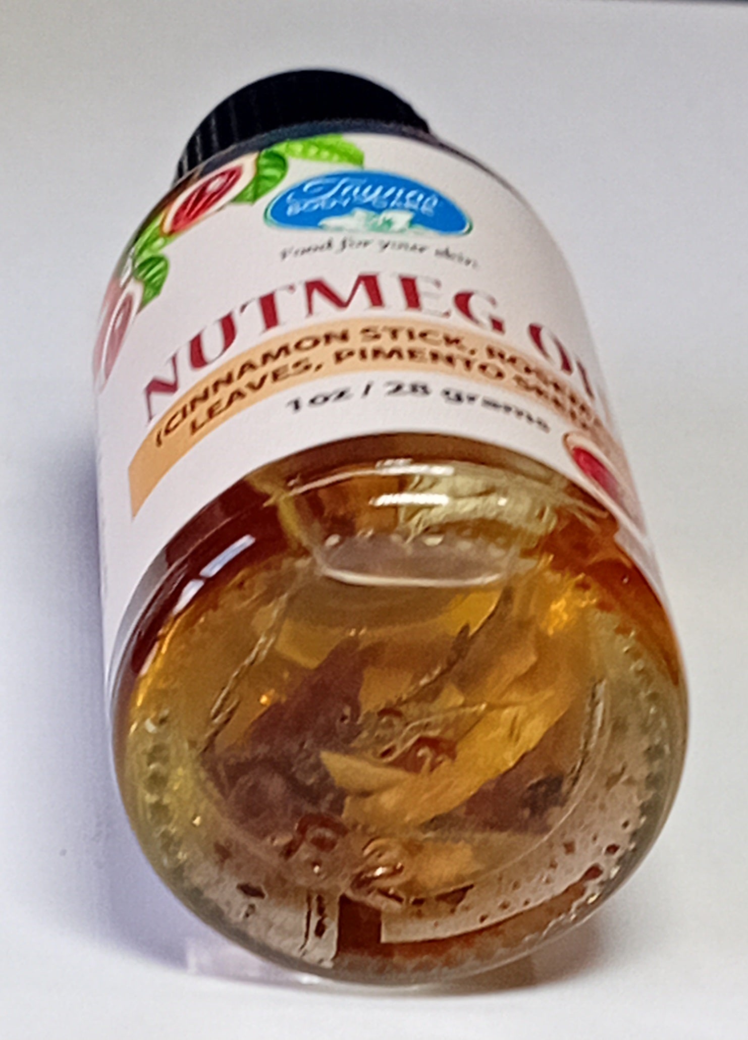 Nutmeg oil bottle from Taynas Body Care, natural body care product with a clear label and dropper cap on a white background.
