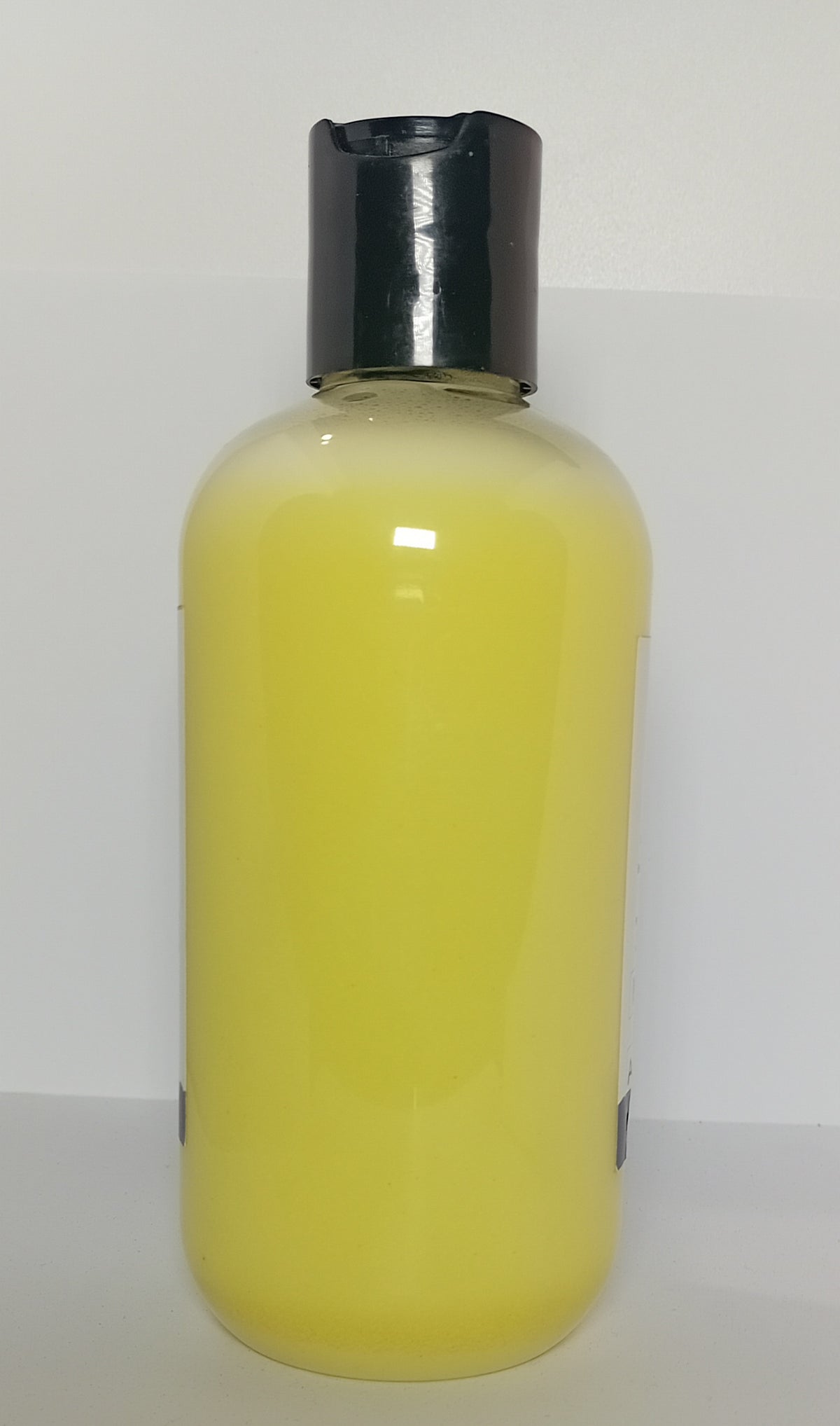 Taynas Body Care ACNE & FUNGI AWAY sulfur face, hair, and body wash in a clear bottle with pump dispenser.